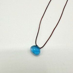 Small blue crystal on black thread necklace